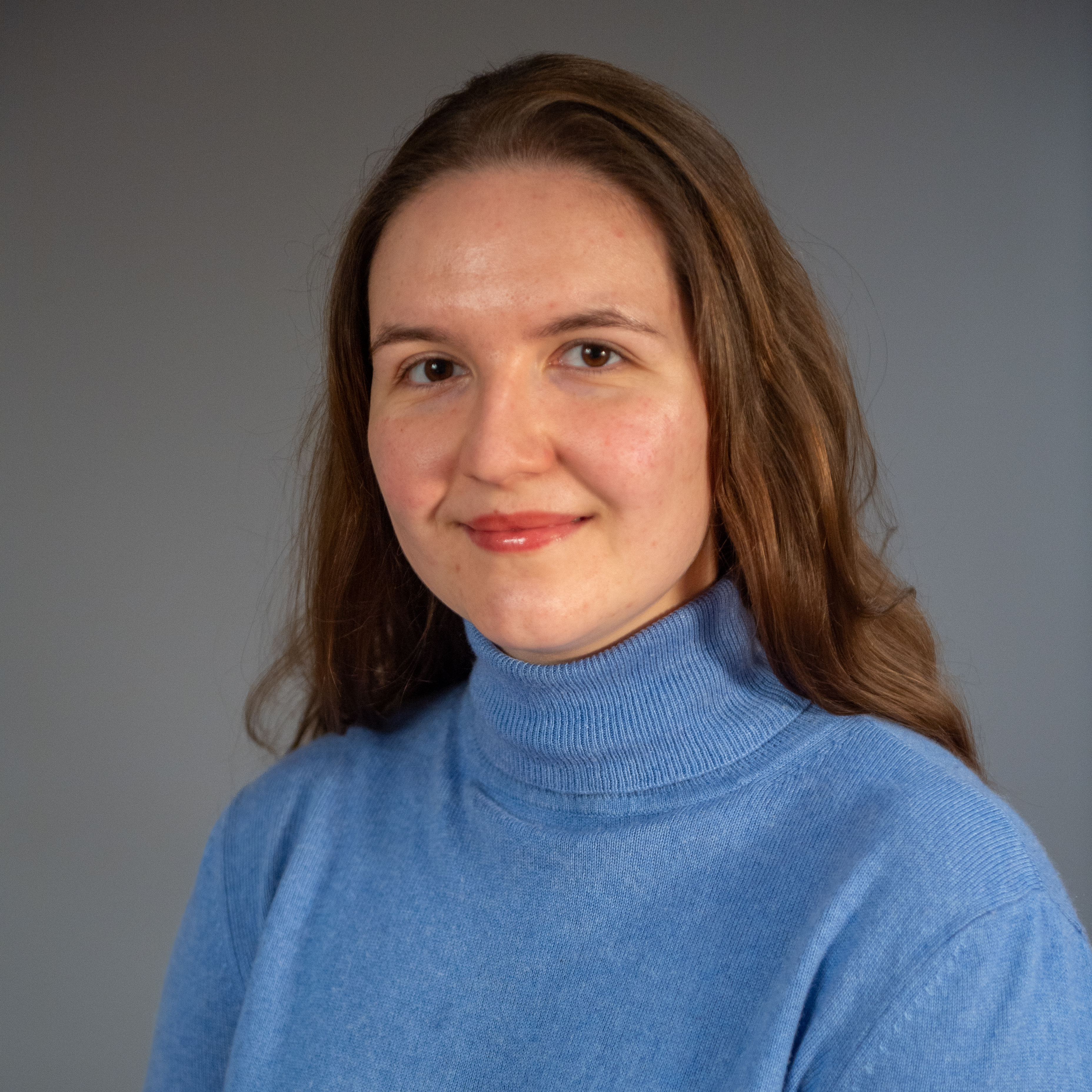 photo of adilia in a blue turtleneck