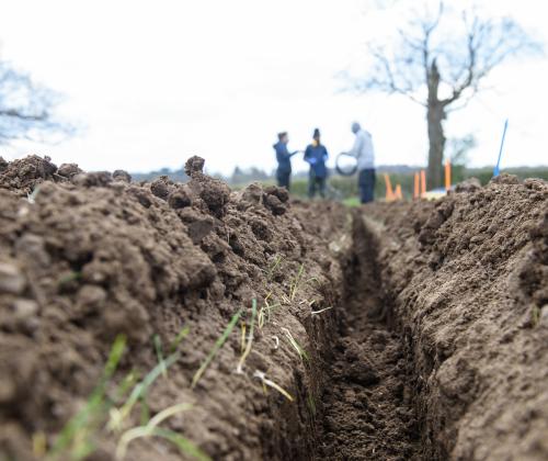 field with a ditch dug into it