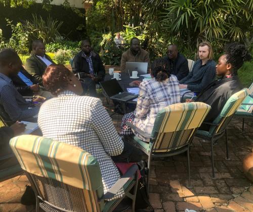 group of scientists sitting round a table